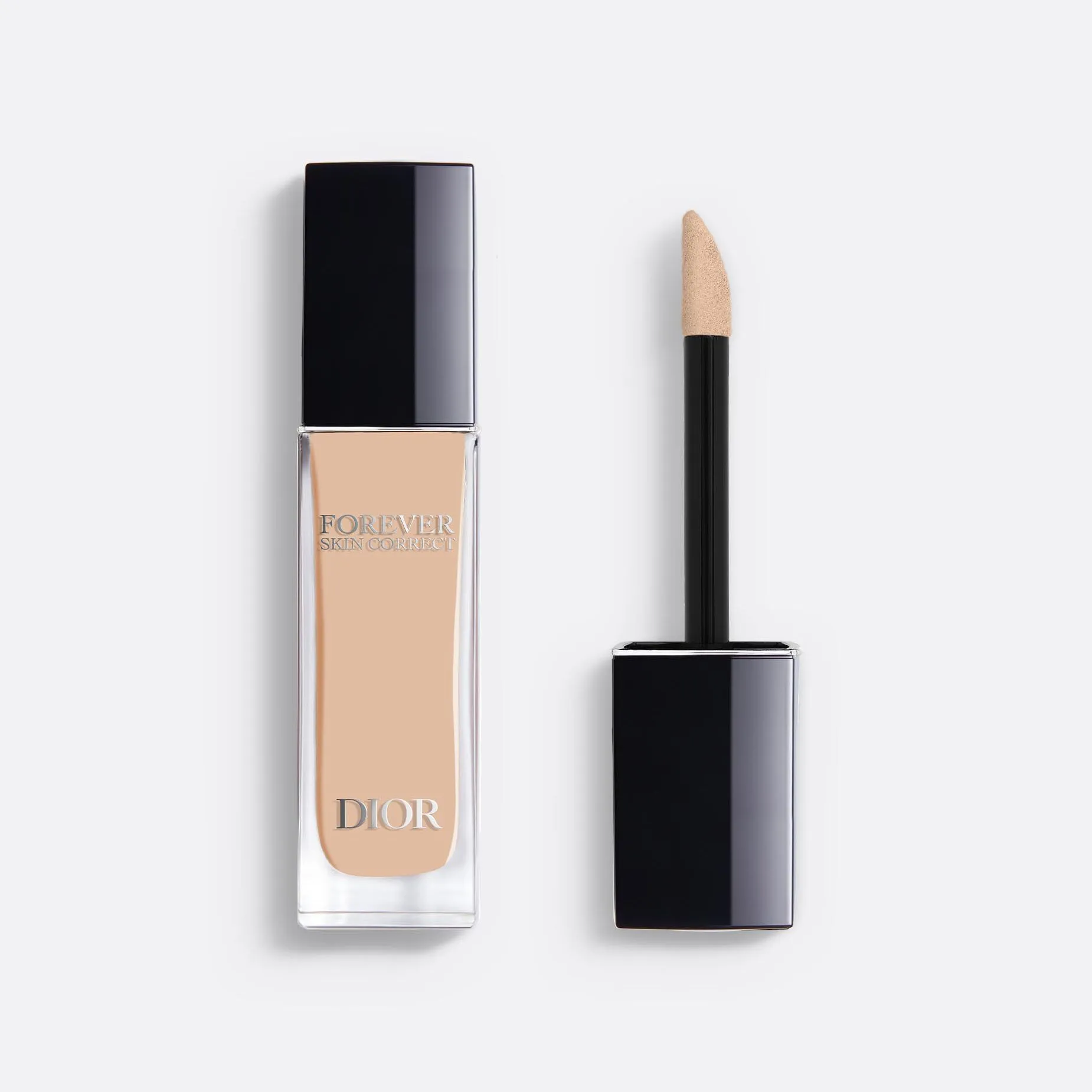 A closed tube of the Dior Forever concealer next to the wand out of the tube. 