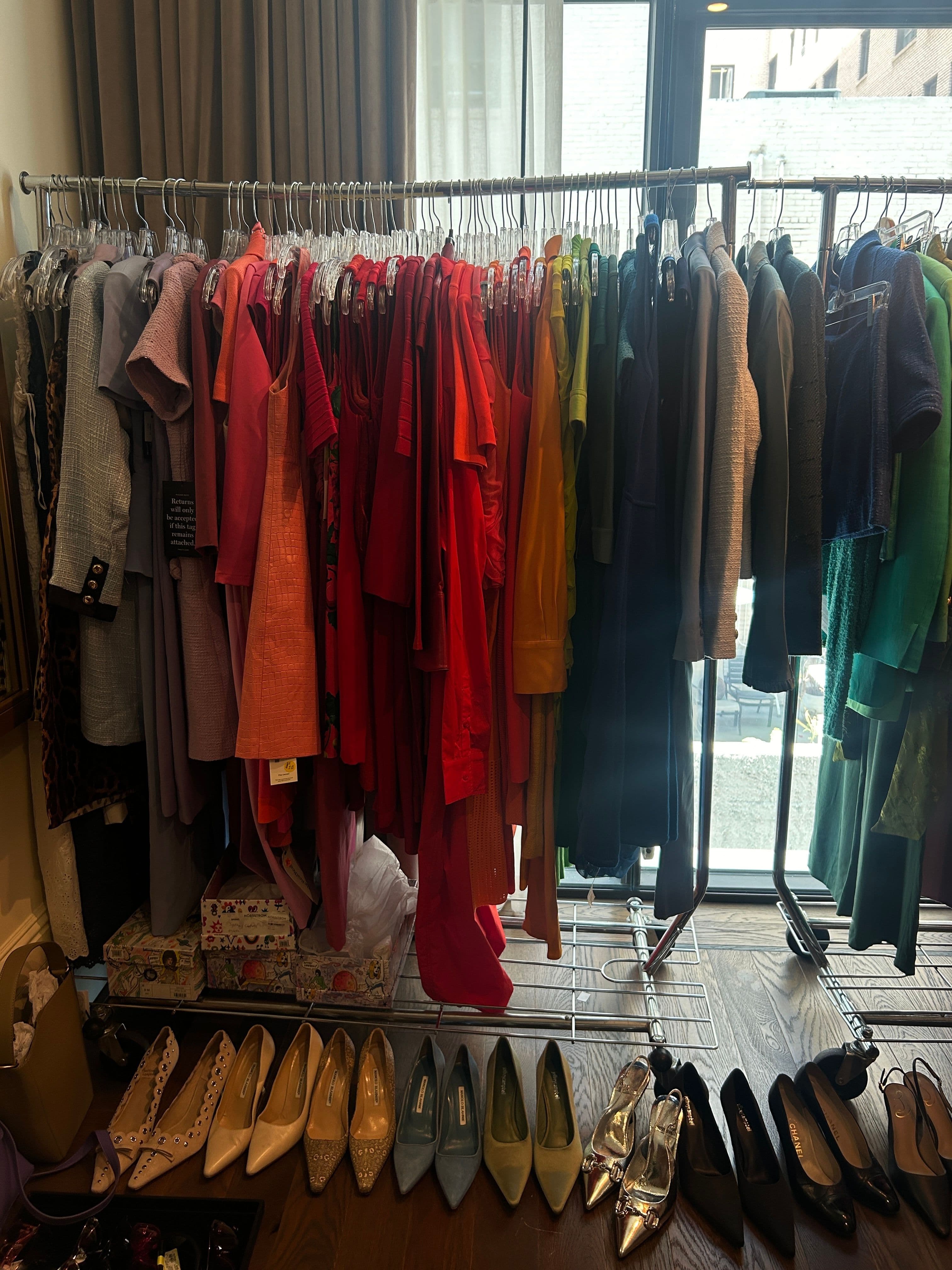 A rail showing the range of monochromatic outfits used in the show.