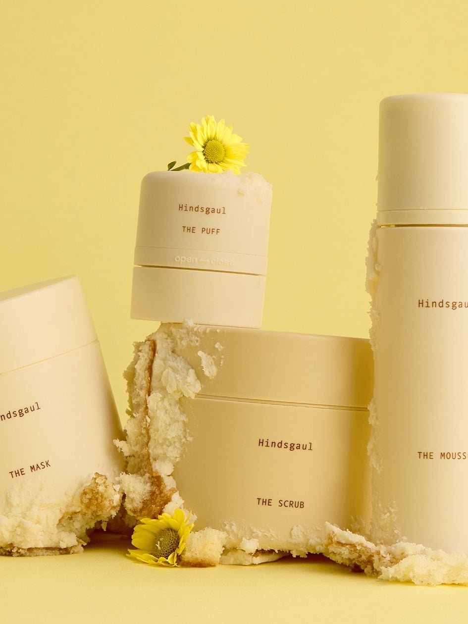 All four Hindsgaul Hair Essentials hair products arranged in a still life 