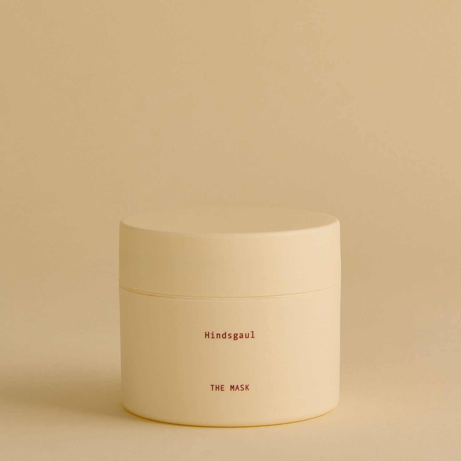 A jar of Hindsgaul Hair The Mask Conditioner against a yellow background 