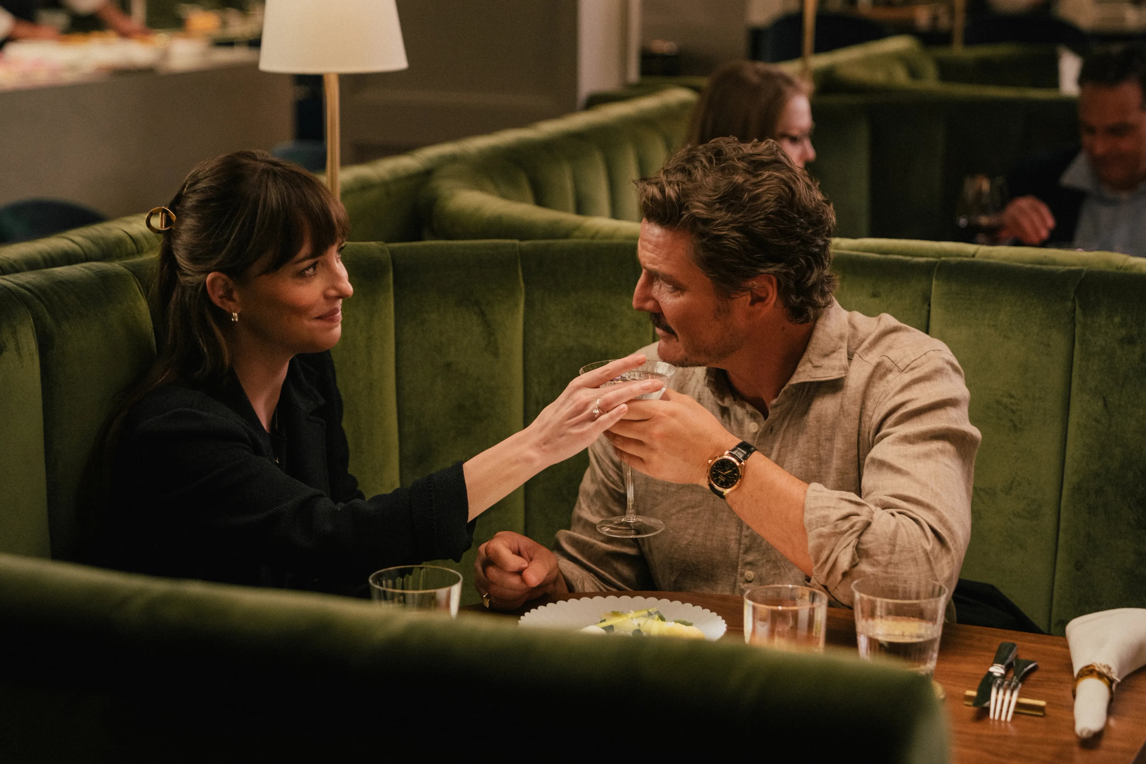 (L - R) Dakota Johnson and Pedro Pascal in "Materialists"