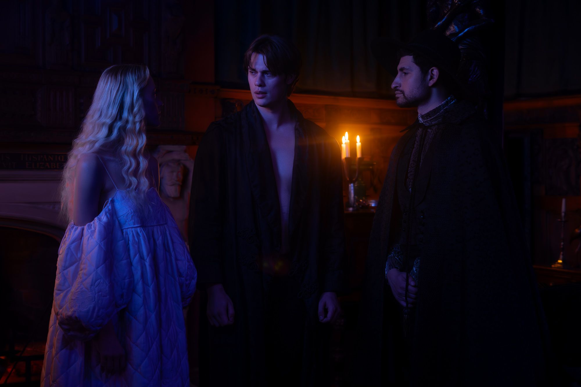 Maika Monroe, Nicholas Galitzine, and Amir El-Masry convene in candlelight in "100 Nights of Hero."