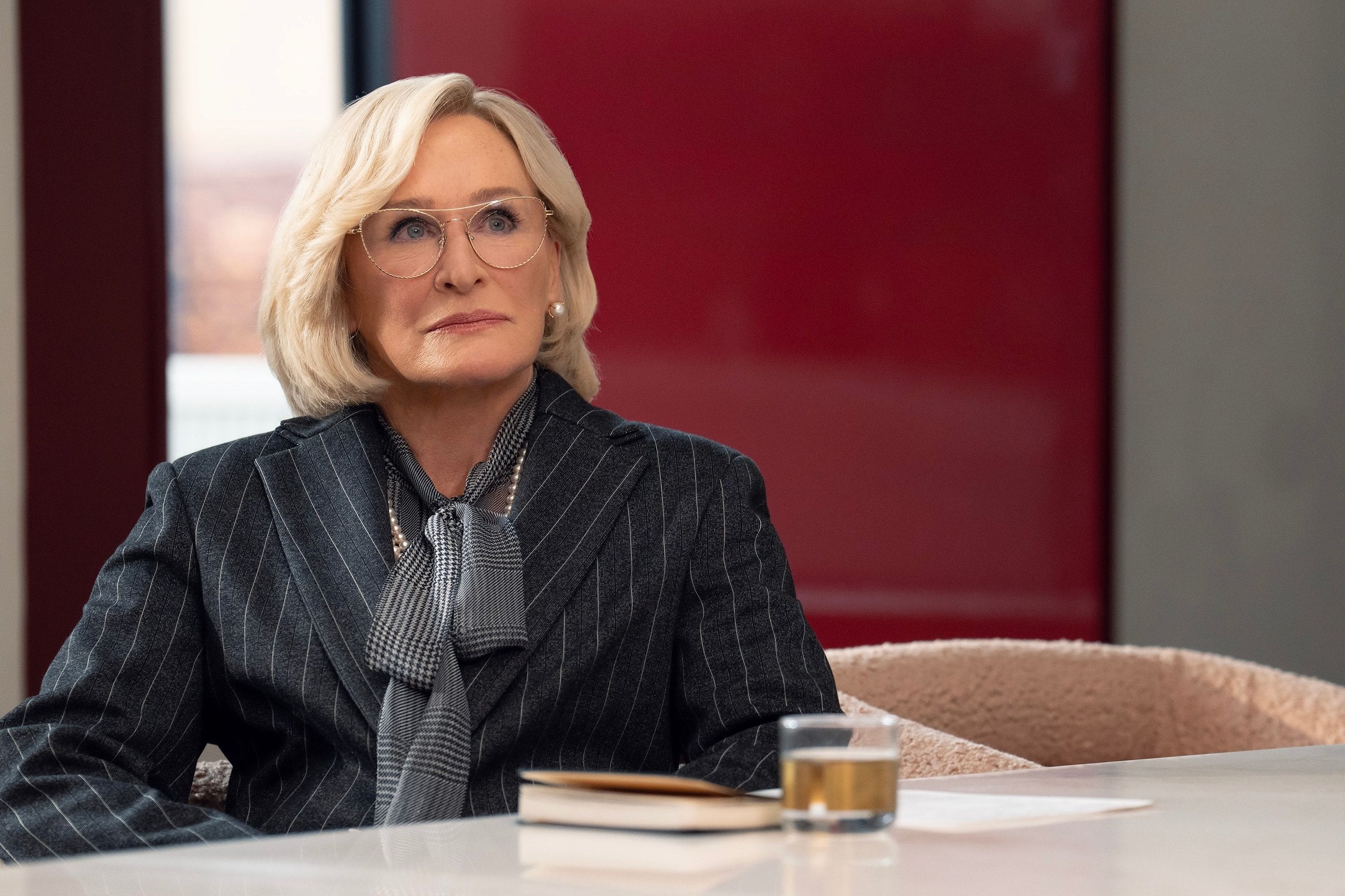 Glenn Close sits at a conference table in a still from All's Fair.