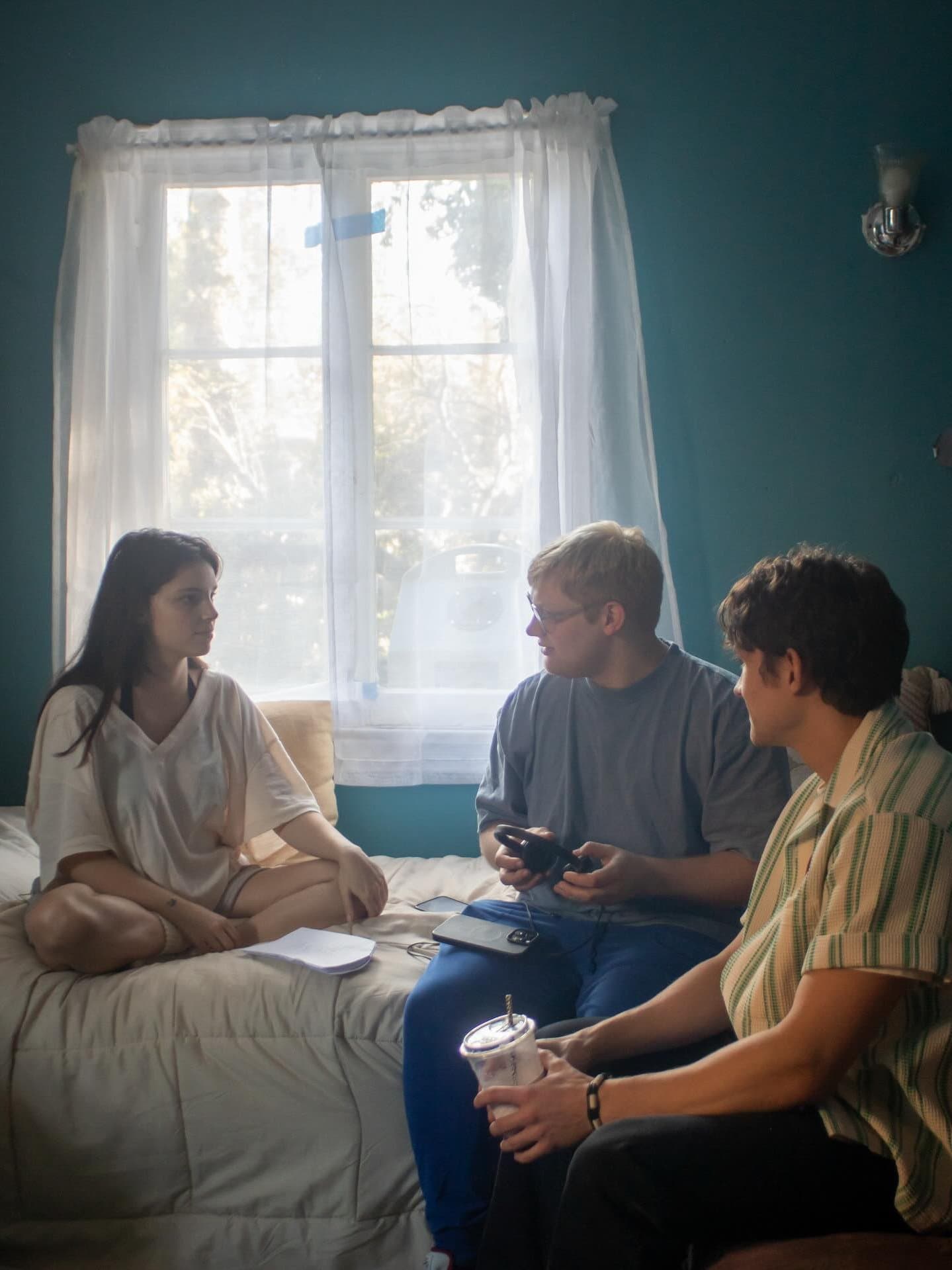 Inde Navarrette and Michael Johnston with director Curry Barker on the set of "Obsession."