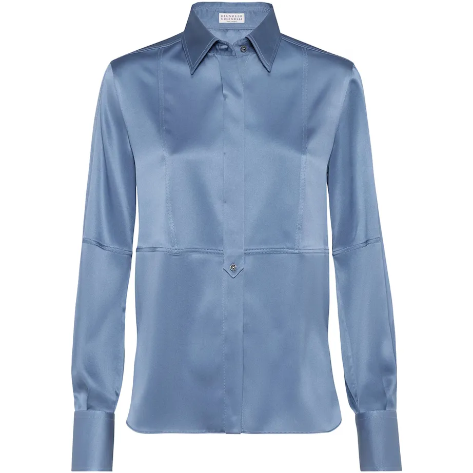 A Brunello Cucinelli silk shirt in a pale blue against a white background.