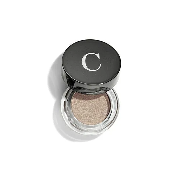 An open jar of Chantecaille Mermaid Eye Color in Seashell, a subdued gold color