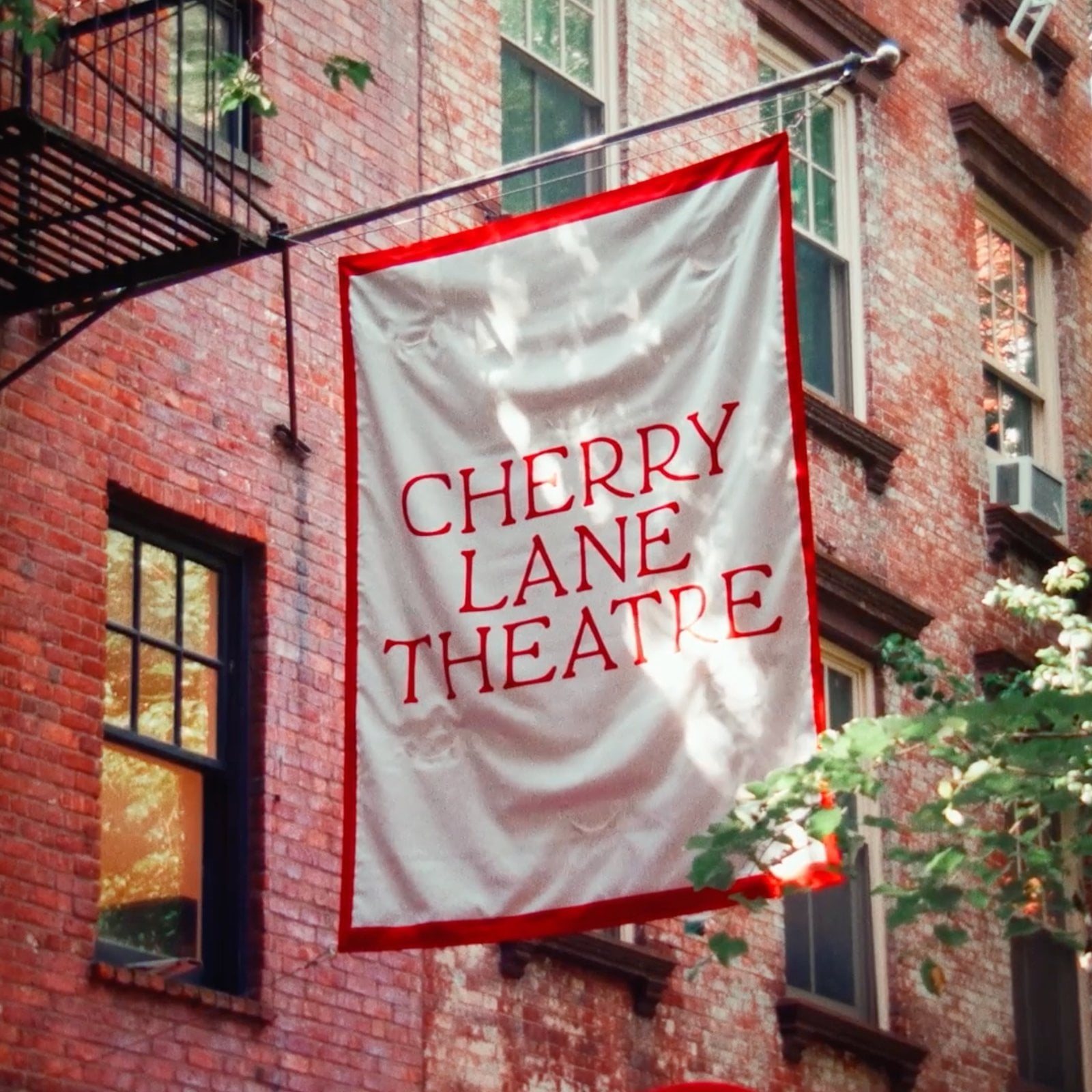 White and red Cherry Lane Theatre banner.