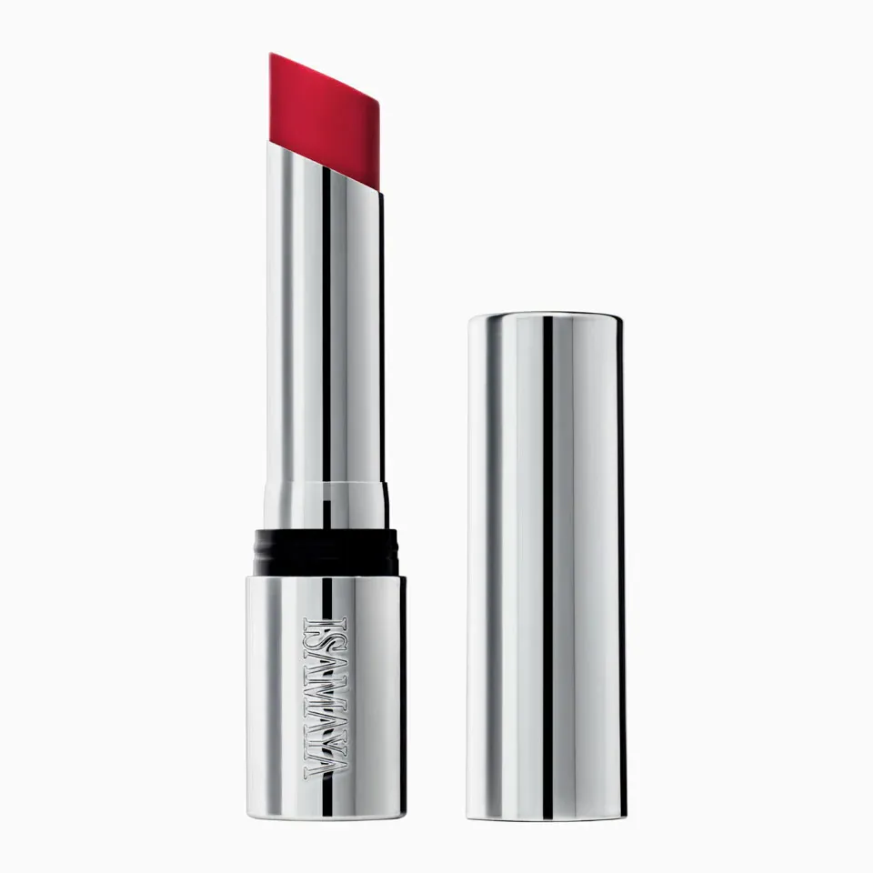 A silver tube of Isamaya's red lipstick against a white background