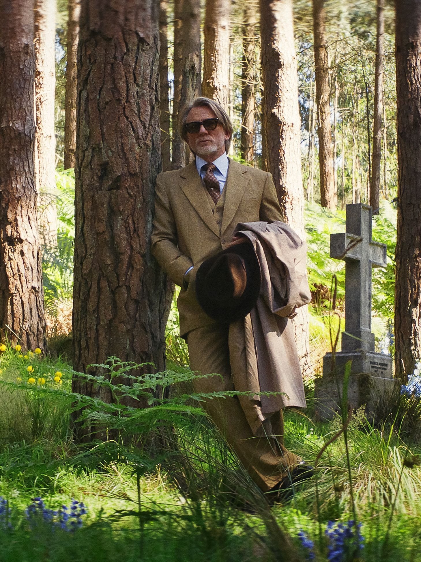 Actor Daniel Craig stands suited in a graveyard in "Wake Up Dead Man: A Knives Out Mystery."
