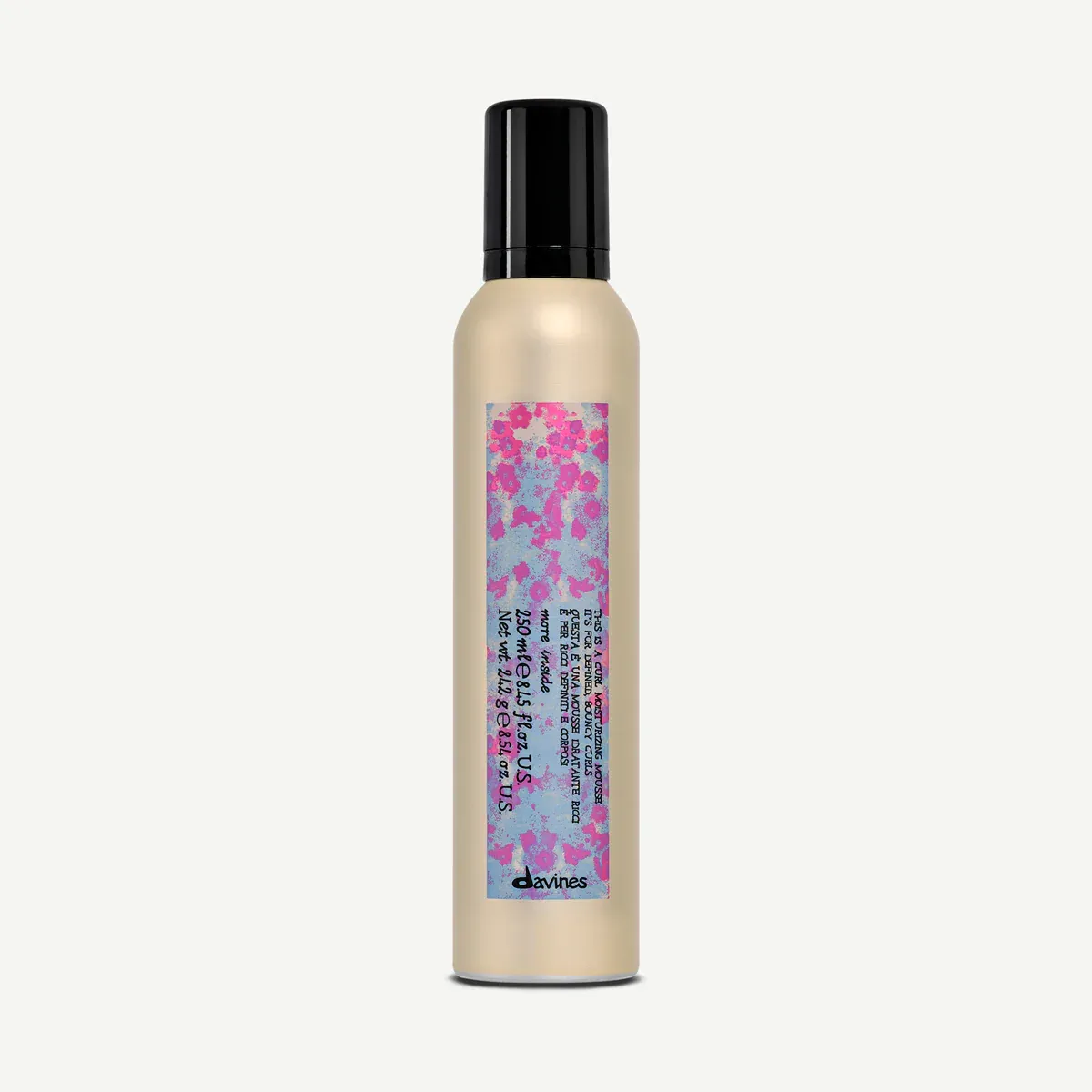A bottleof Davines This is a Curl Moisturizing Mousse against a white background