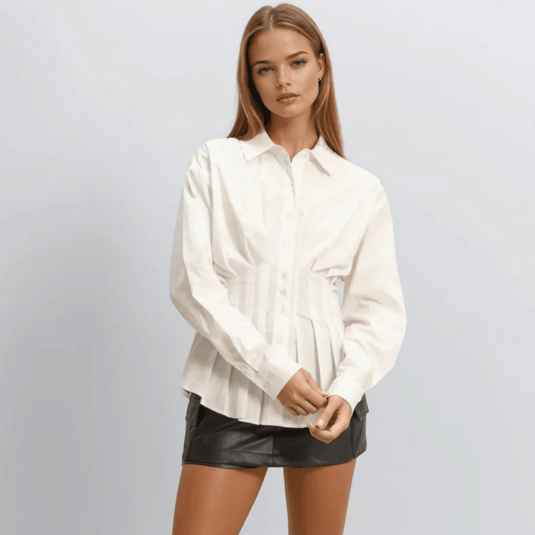 A model wearing the Forever 21 Pleated Poplin Peplum Shirt in white with a black mini skirt