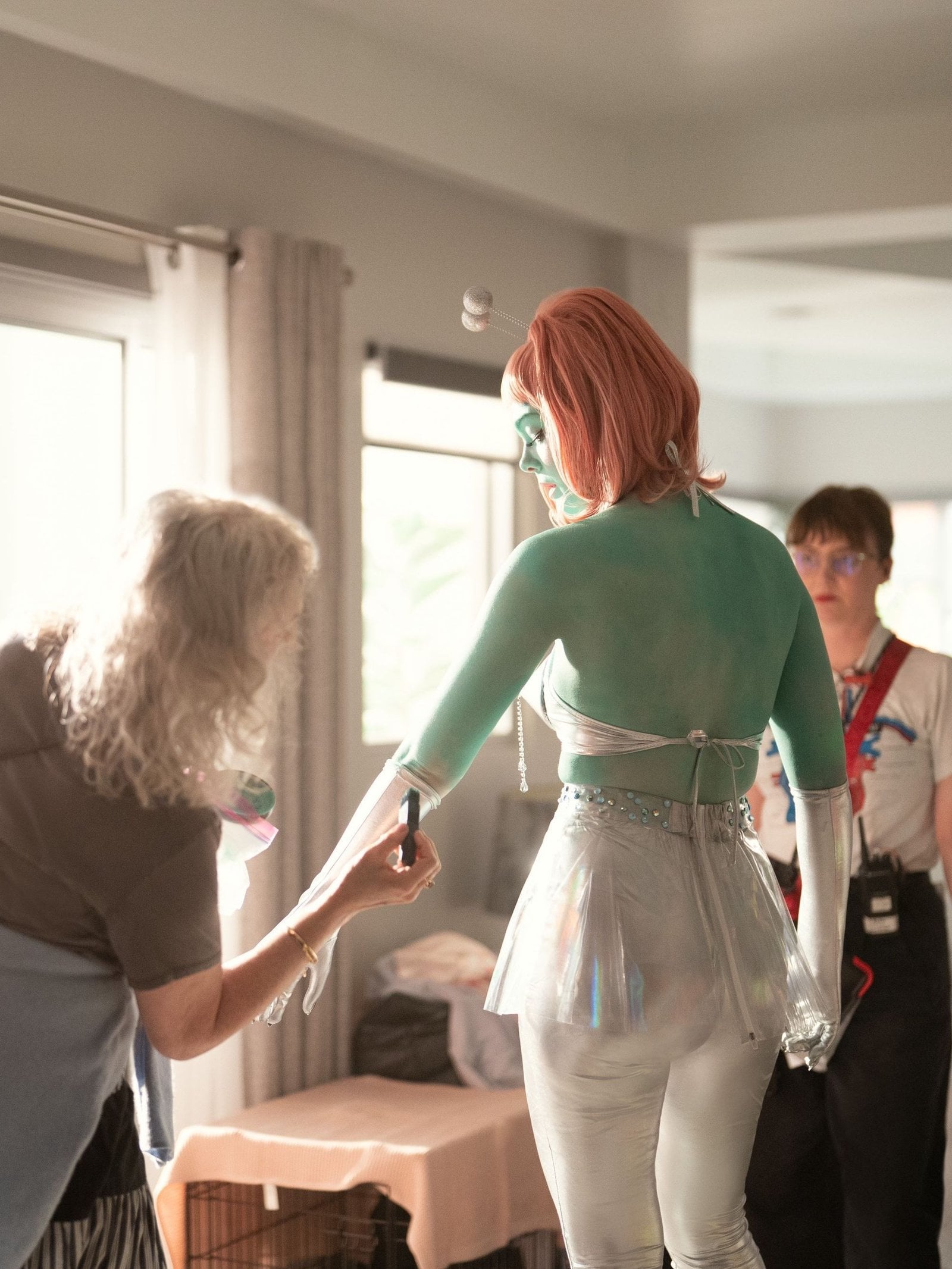 Elle Fanning being painted on the set of "Margo's Got Money Troubles."