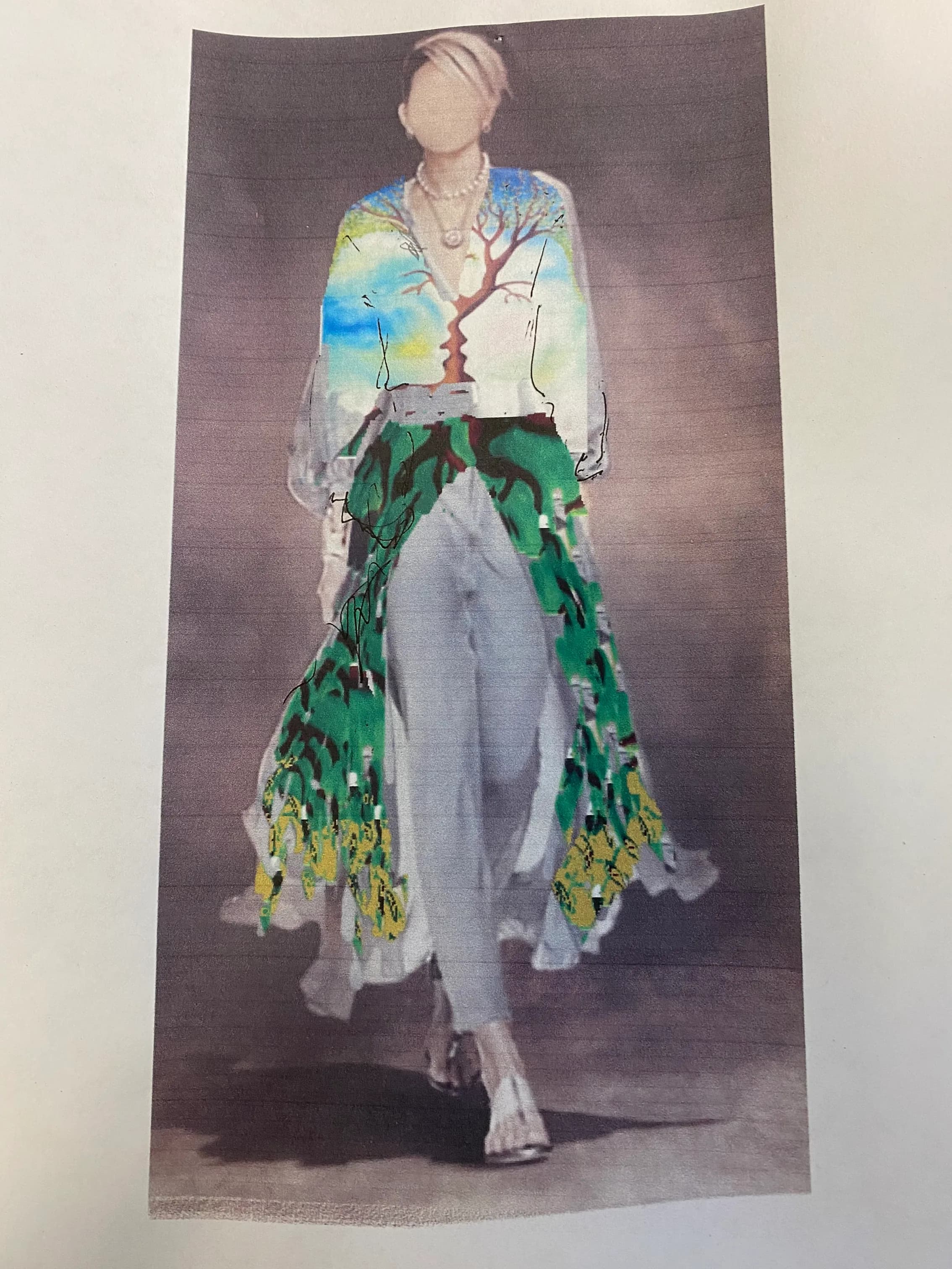 A watercolor sketch of a faceless model walking down the runway in a flowy dress over pants.