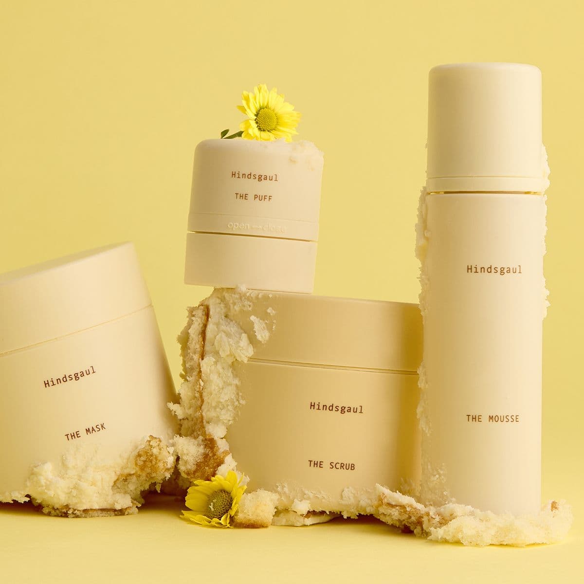 All four Hindsgaul Hair Essentials hair products arranged in a still life