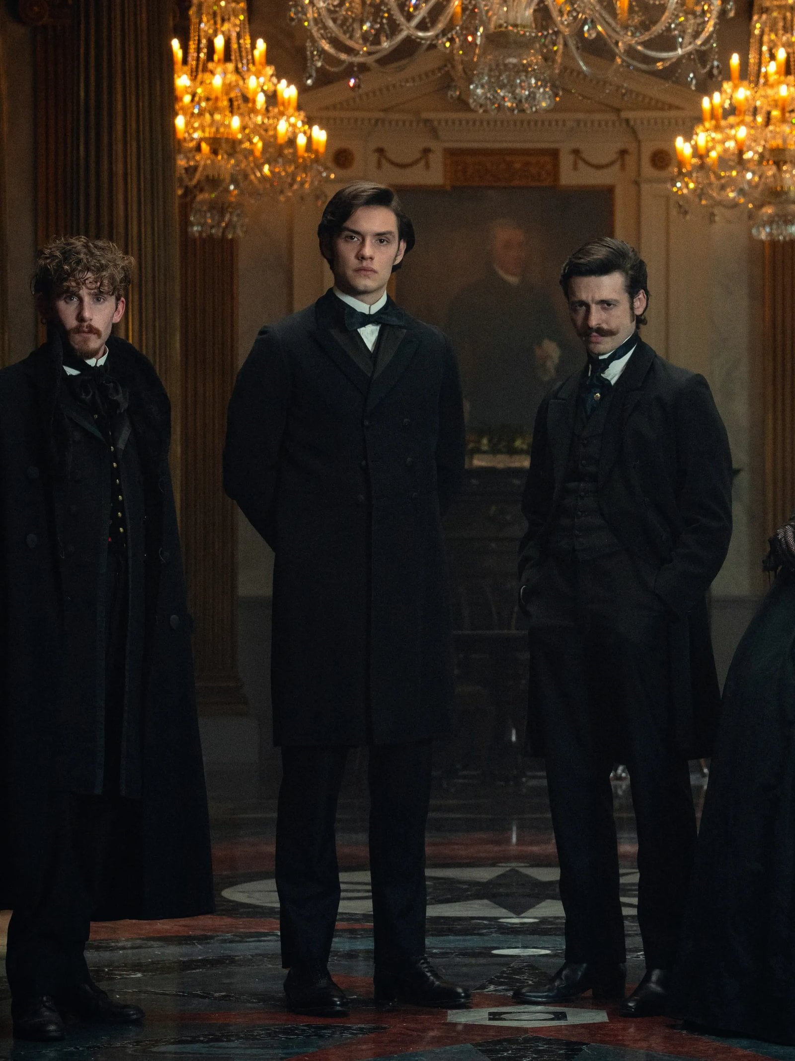 The four Guinness siblings portrayed by actors, stand in a grand foyer, in a still from the "House of Guinness."
