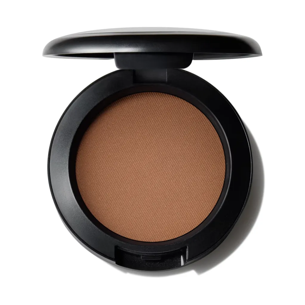 An open compact of MAC Powder Blush in Blunt, a medium brown powder, against a white background