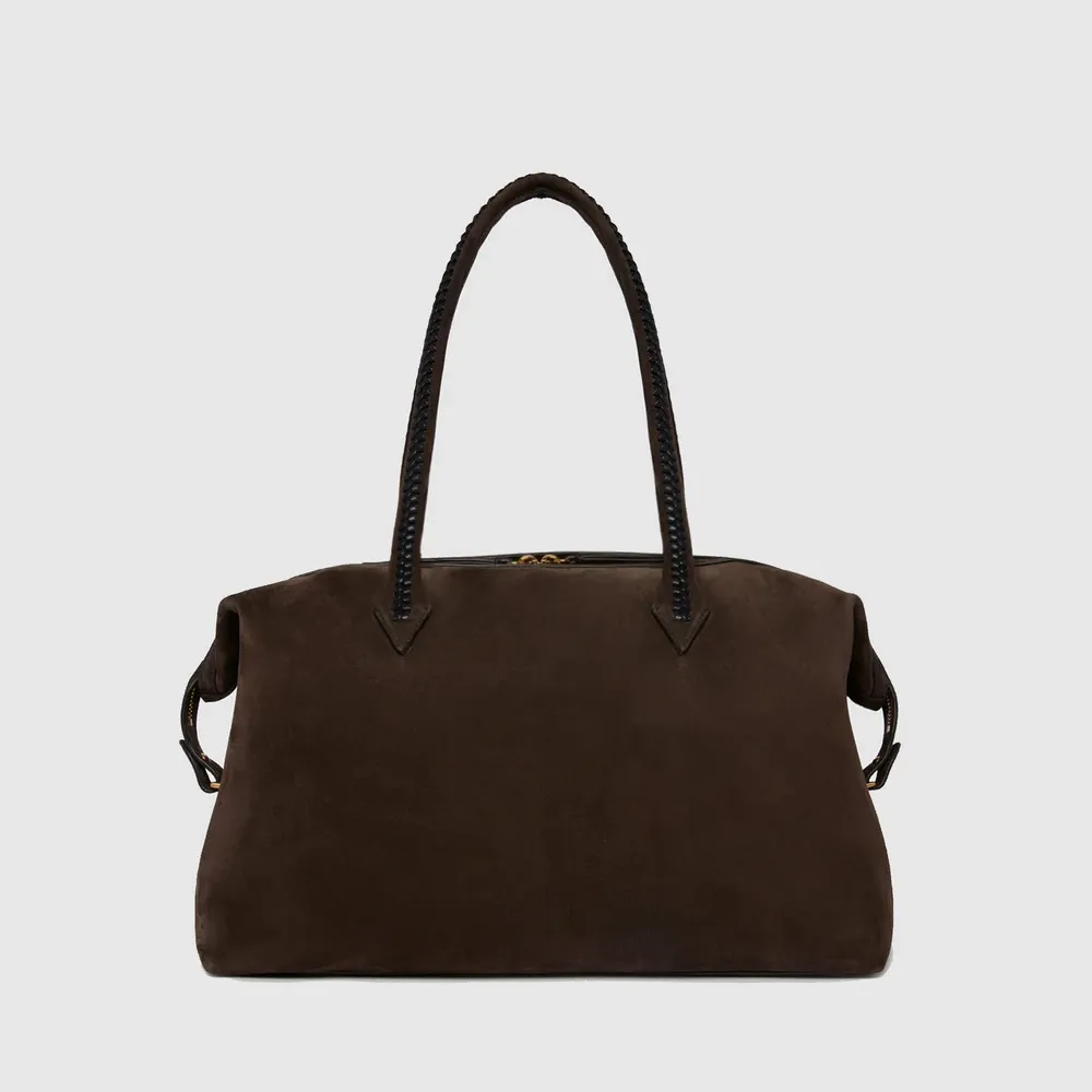 Métier Vérité All Day tote in a dark brown color against a gray background