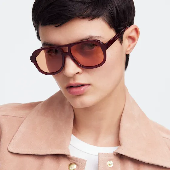 A model wears Madewell Logaan Aviator Sunglasses