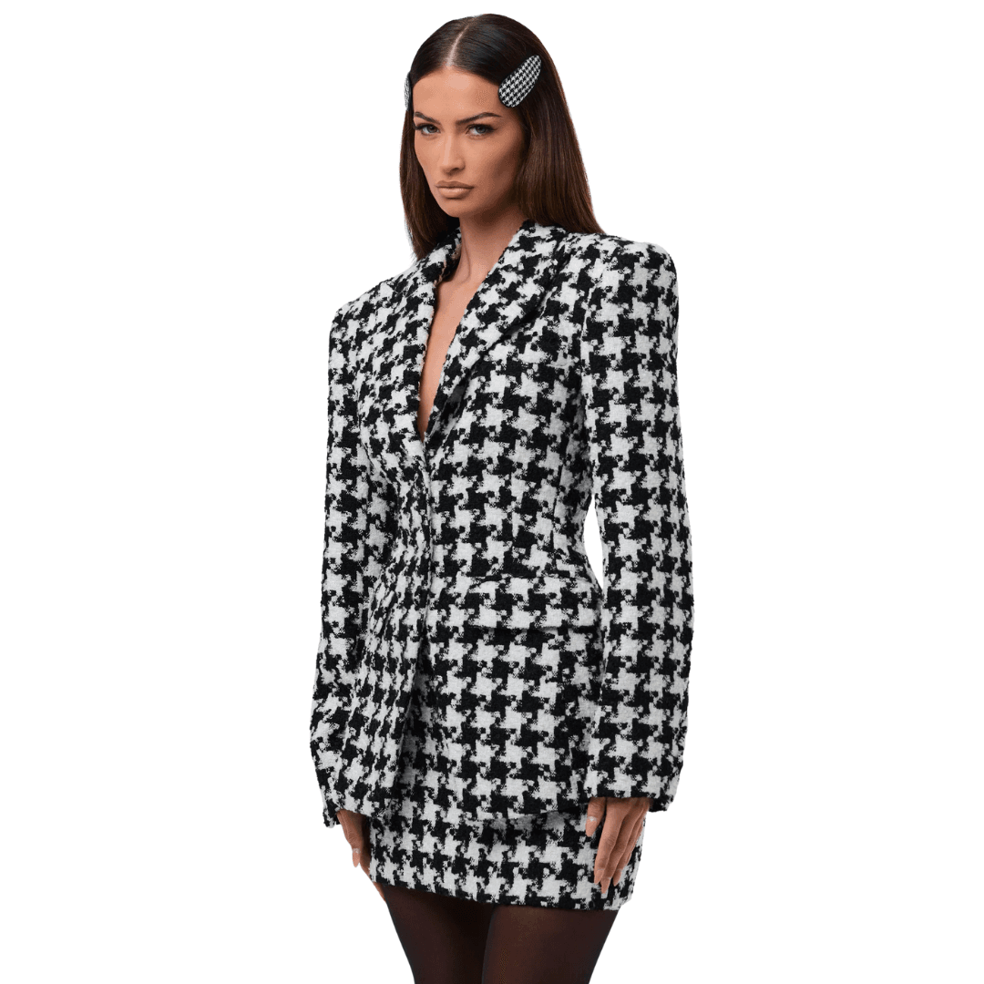 A model wears the black and white Naked Wardrobe Houndstooth Check Tweed Blazer