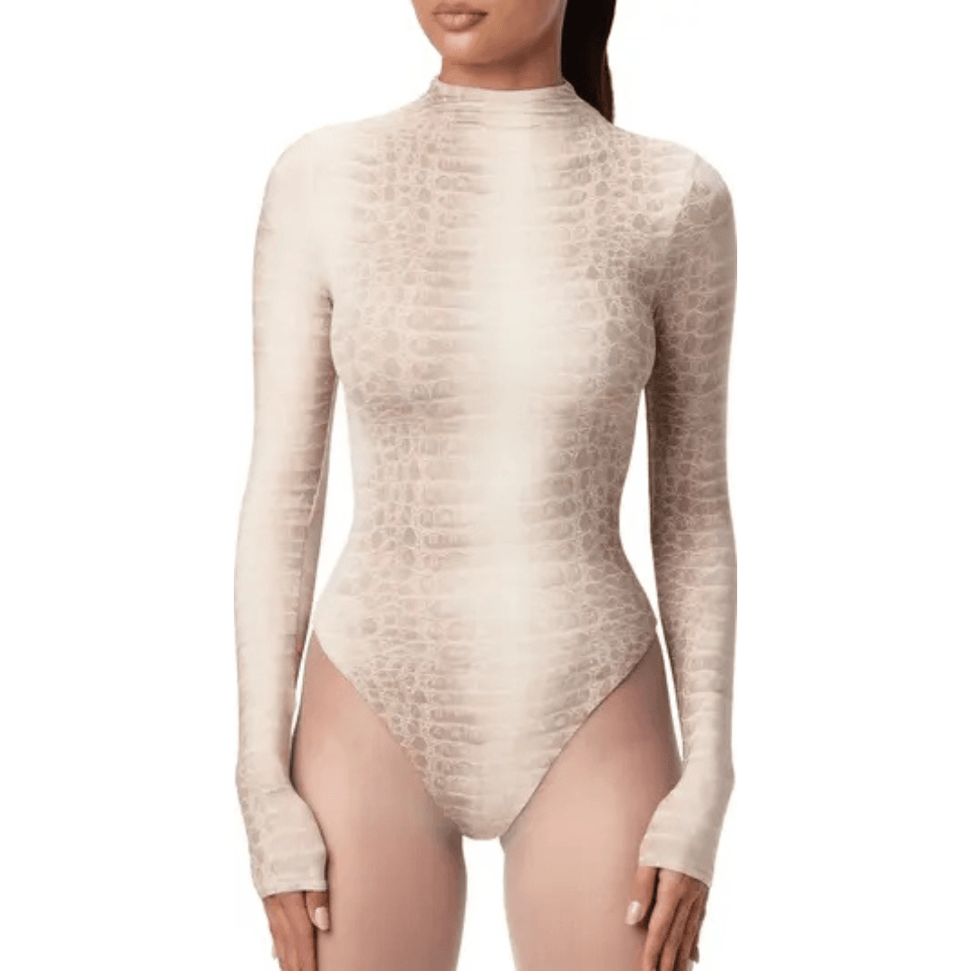 The torso of a model wearing Naked Wardrobe Naked Snakeskin Print Long Sleeve Bodysuit in Bone Croc