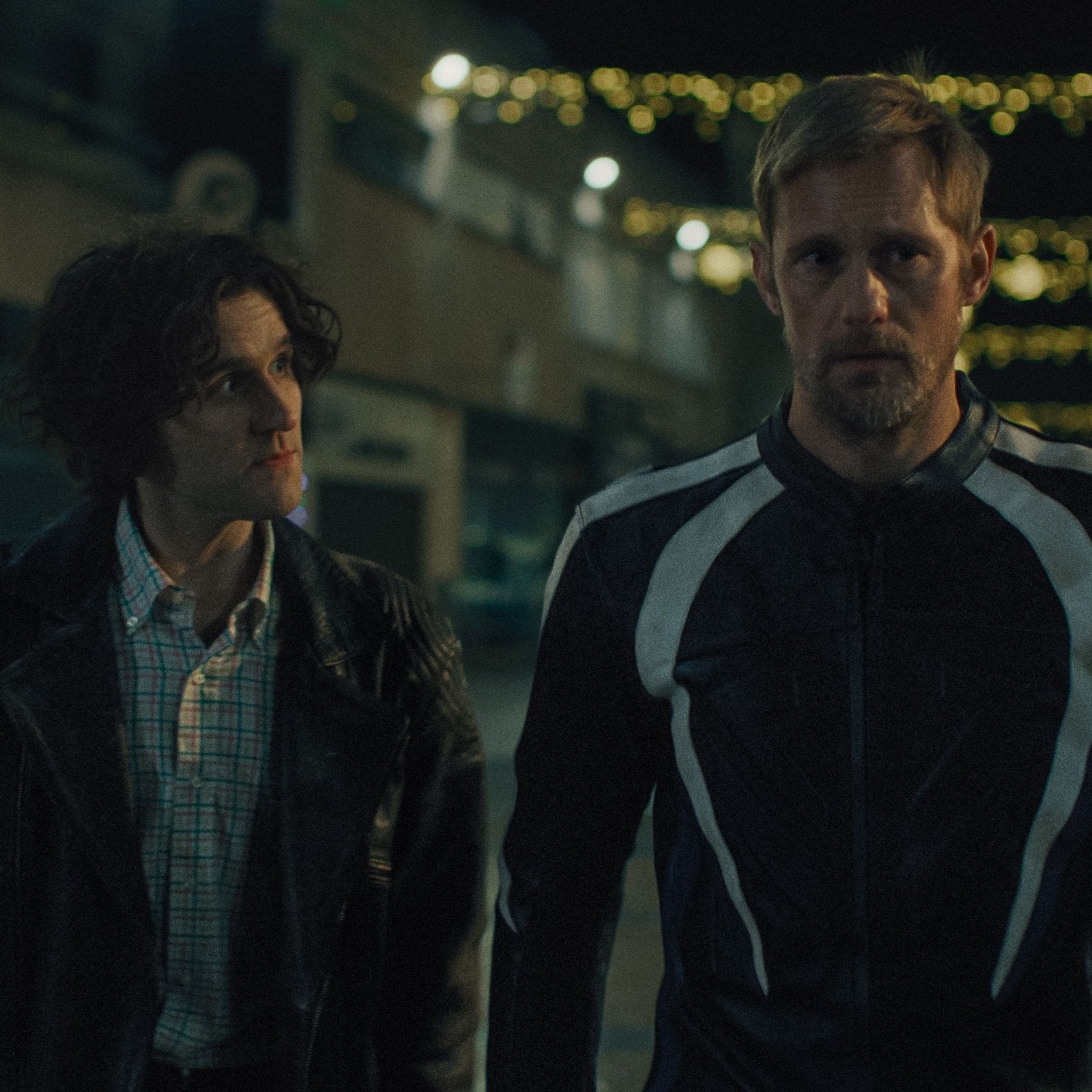 Harry Melling and Alexander Skarsgård in "Pillion."