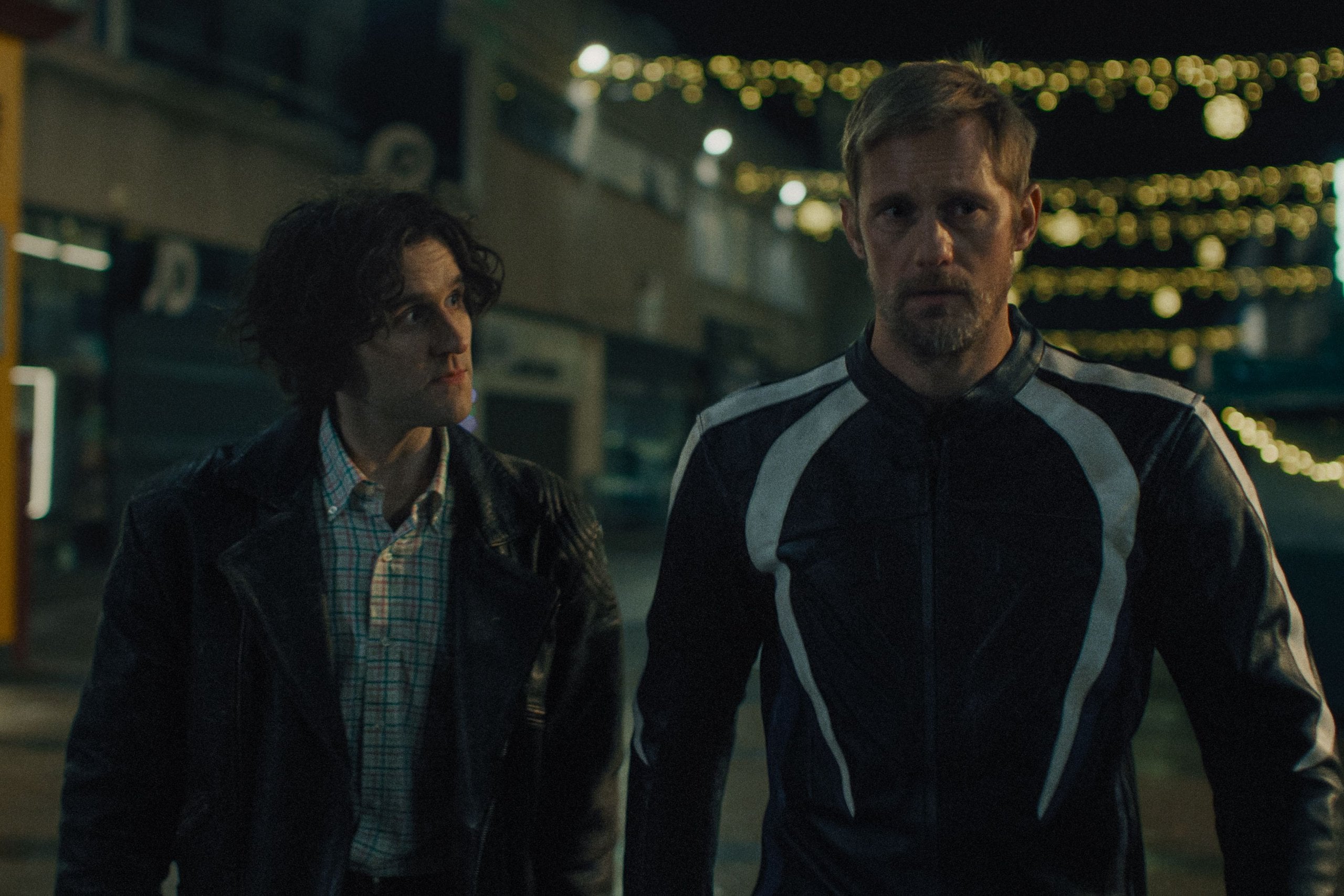 Harry Melling and Alexander Skarsgård in "Pillion."