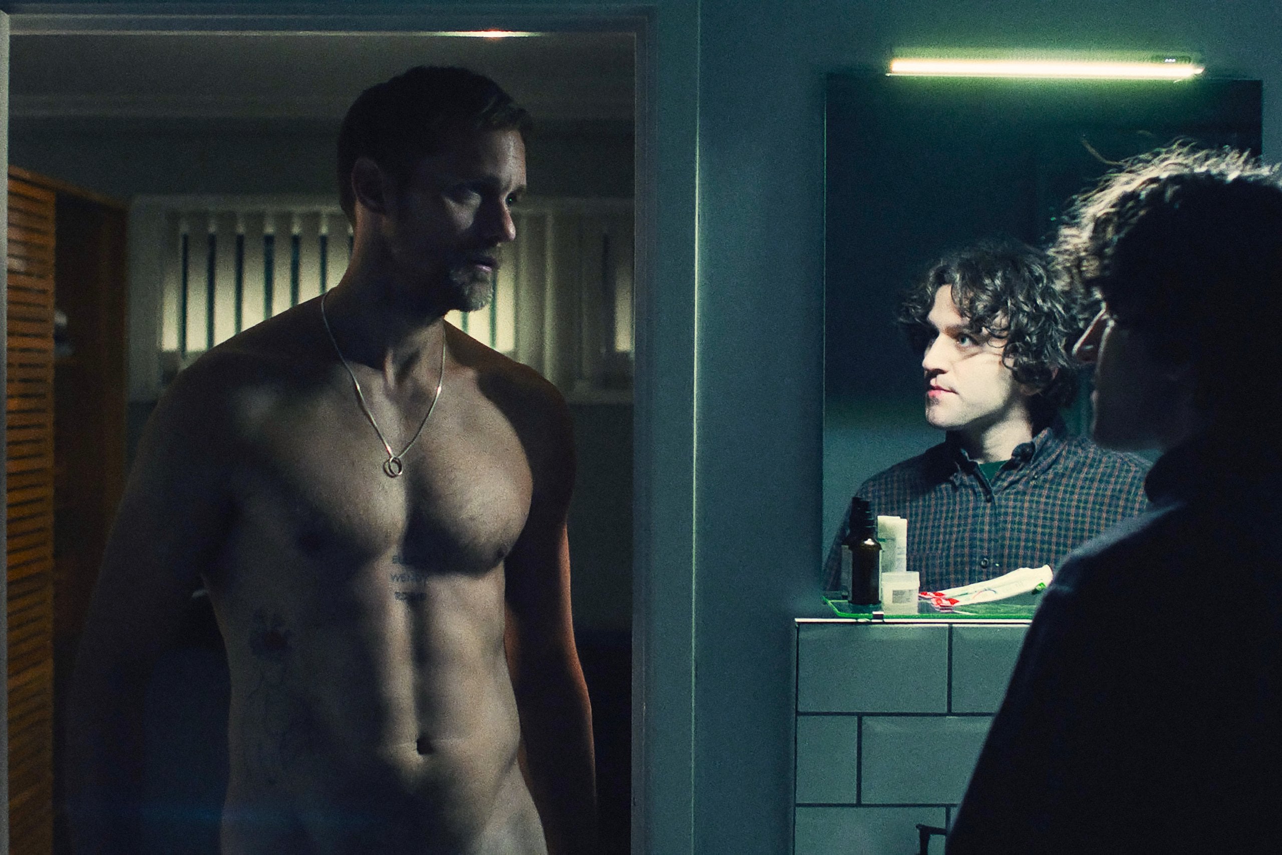 Alexander Skarsgård and Harry Melling in "Pillion."