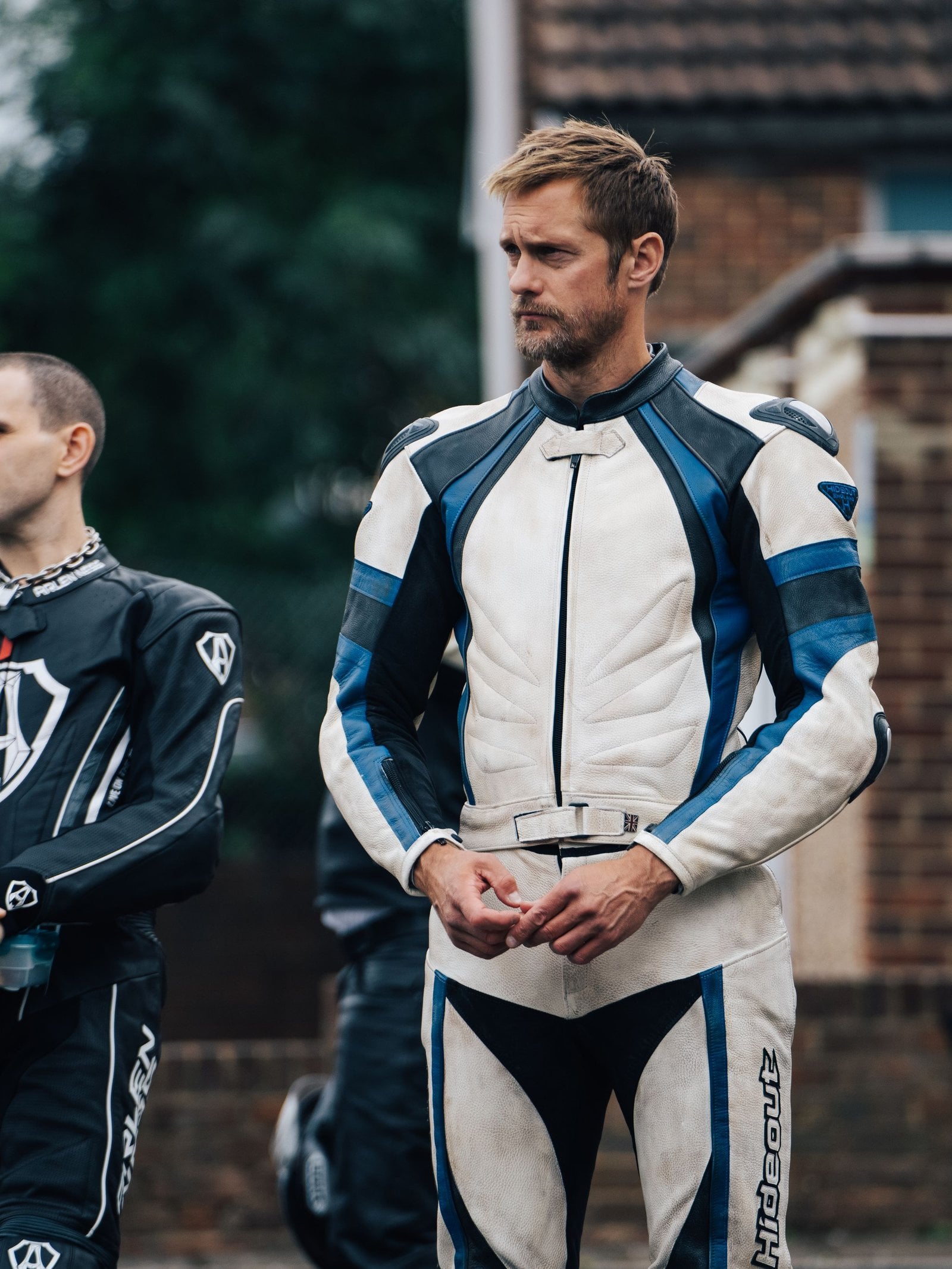 Harry Melling and Alexander Skarsgård in "Pillion."