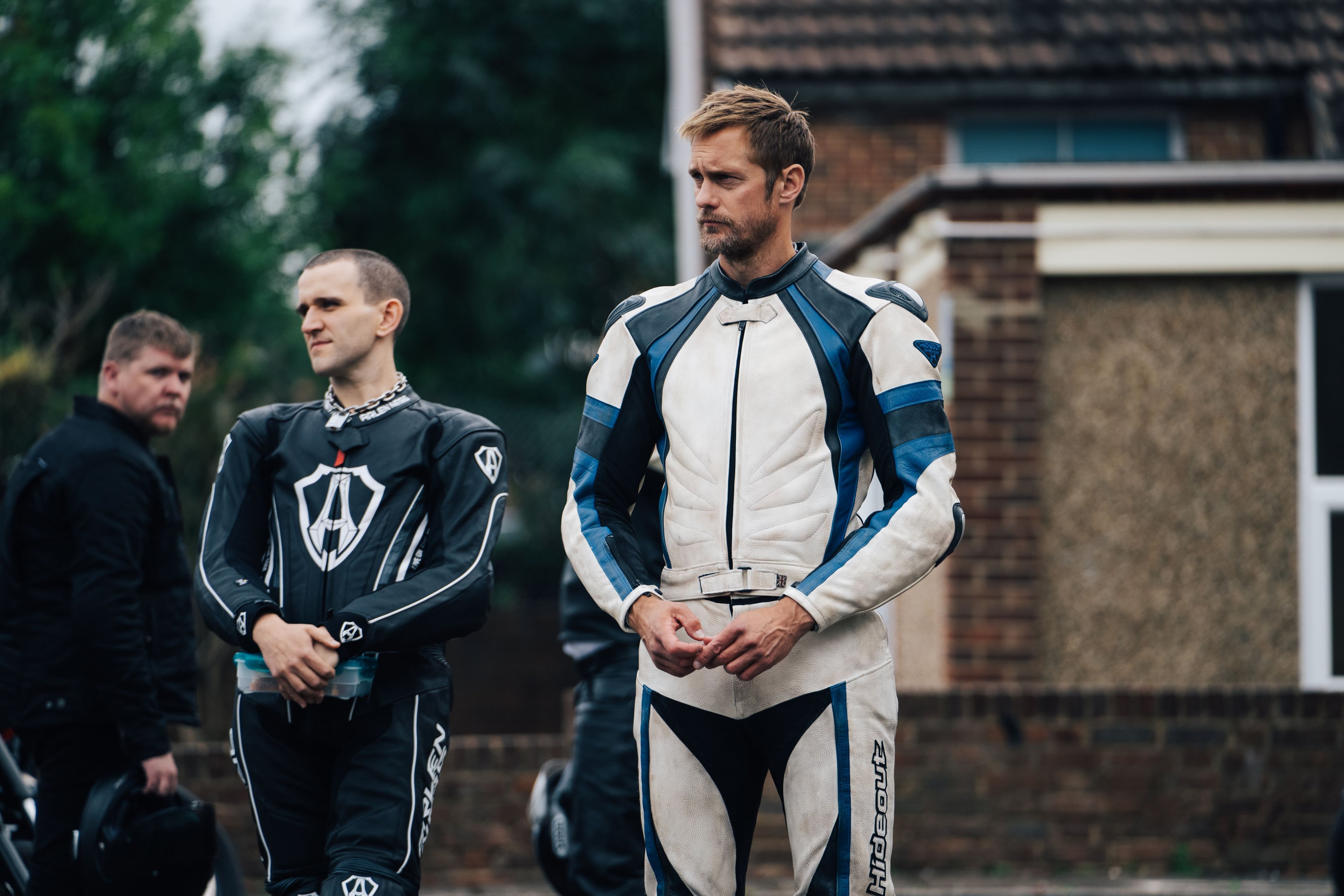 Harry Melling and Alexander Skarsgård in "Pillion."