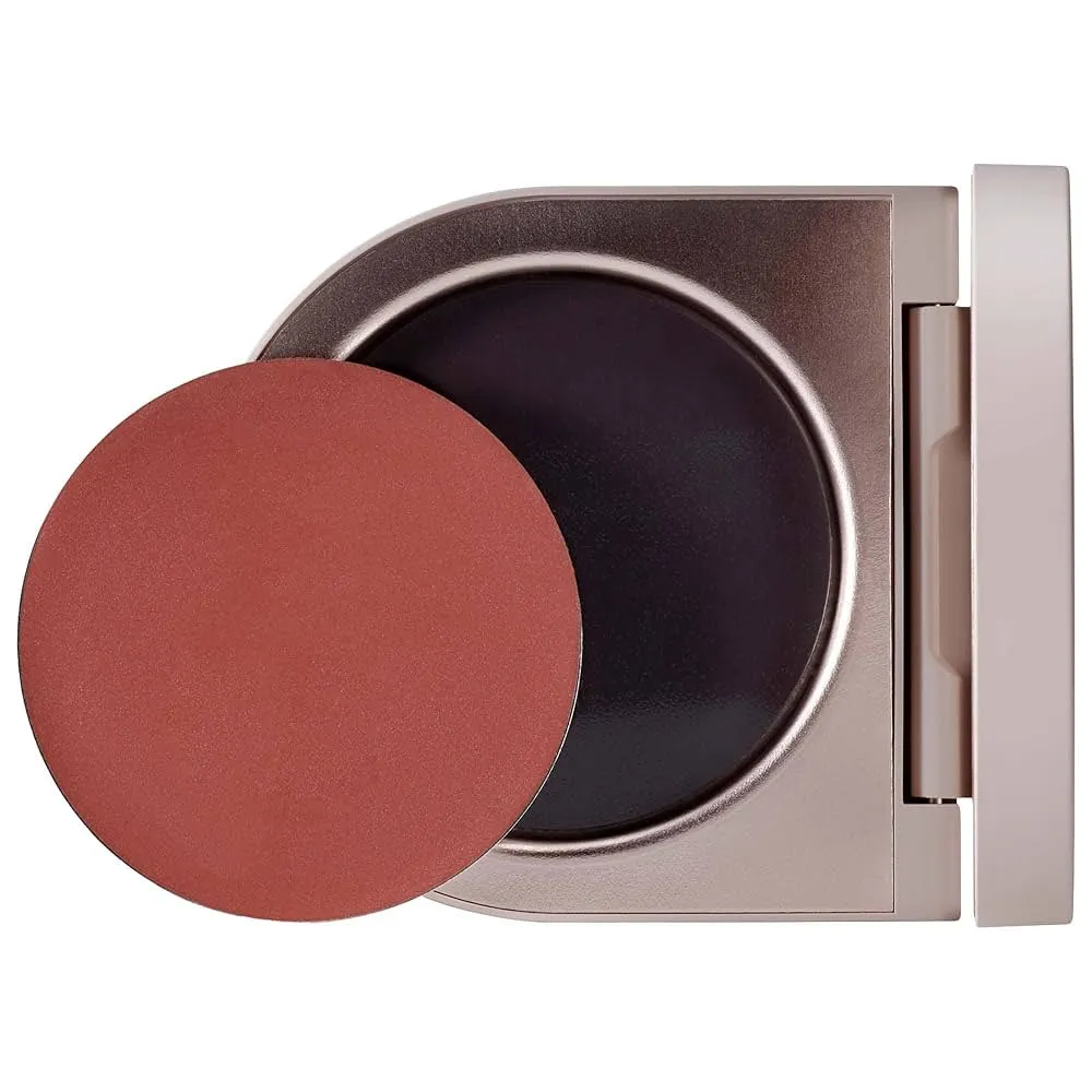 A cream blush compact against a white background