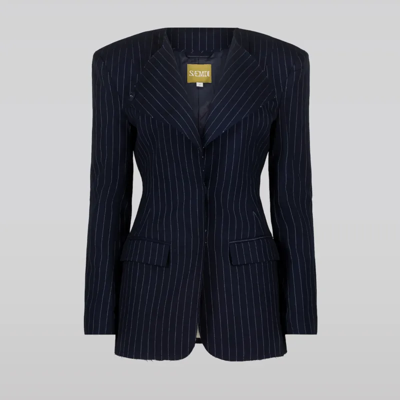 The Saemdi Pinstripe Suit Jacket in navy against a gray background