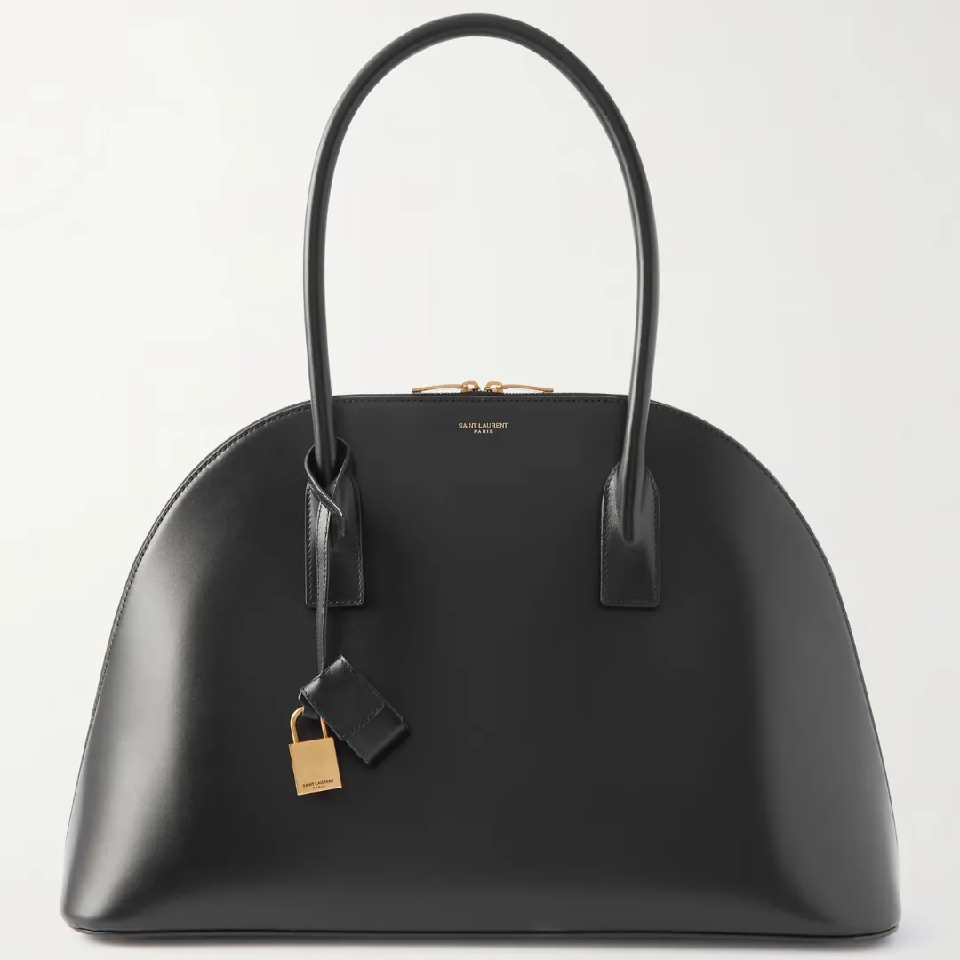 The Saint Laurent Duffle Sac De Jour leather tote against a gray background