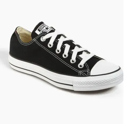 black converse low top sneaker against an off-white background
