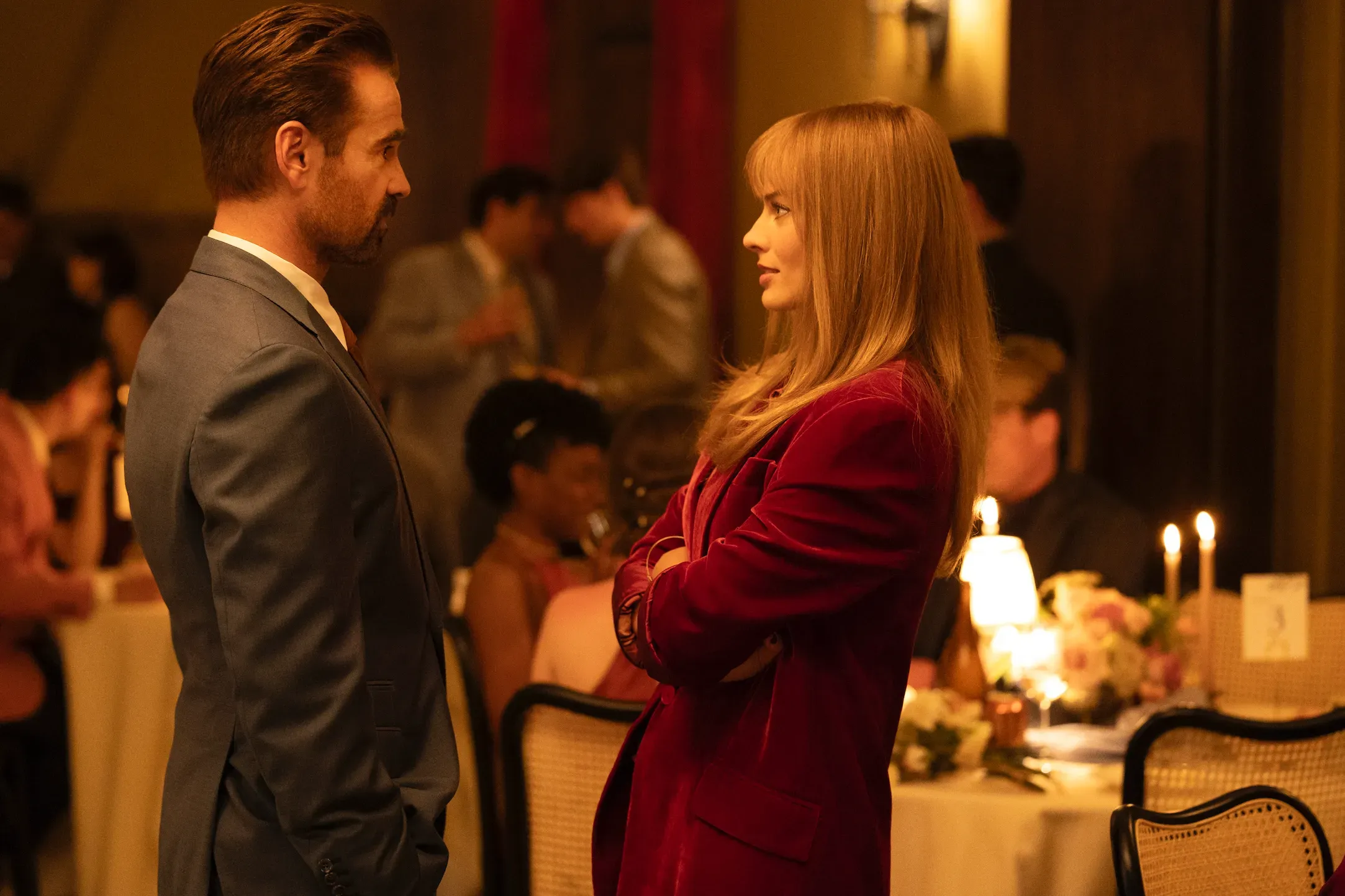 Colin Farrell and Margot Robbie chat while at a wedding in a still from "A Big Bold Beautiful Journey."