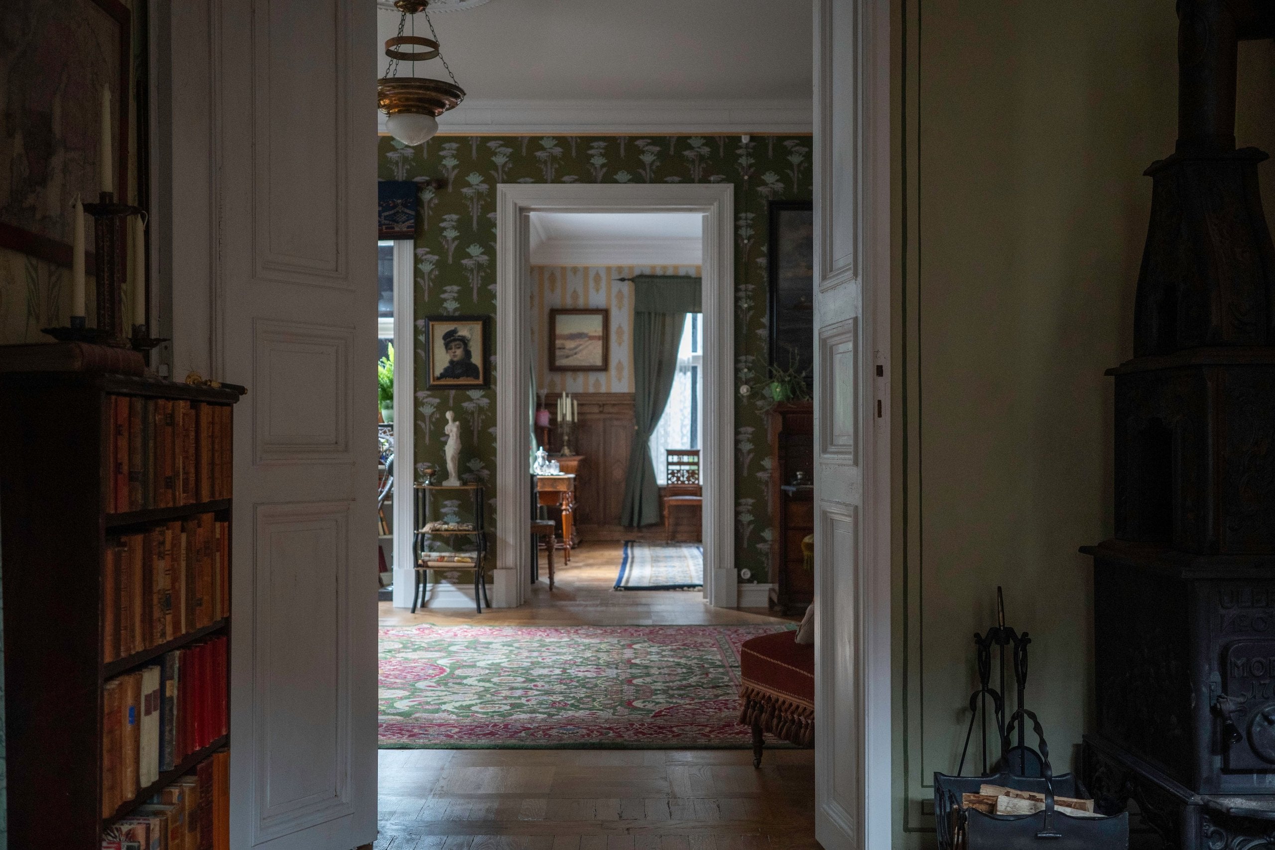 Frame within a frame still of interior doorway in "Sentimental Value."