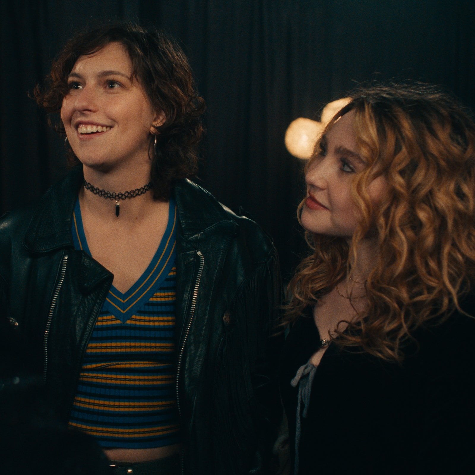 Actors King Princess and Ella Anderson dressed in 90s grunge in a stillfrom Song Sung Blue.