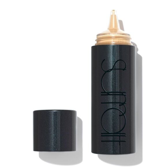 An open bottle of Surratt Beauty Dew Drop Foundation