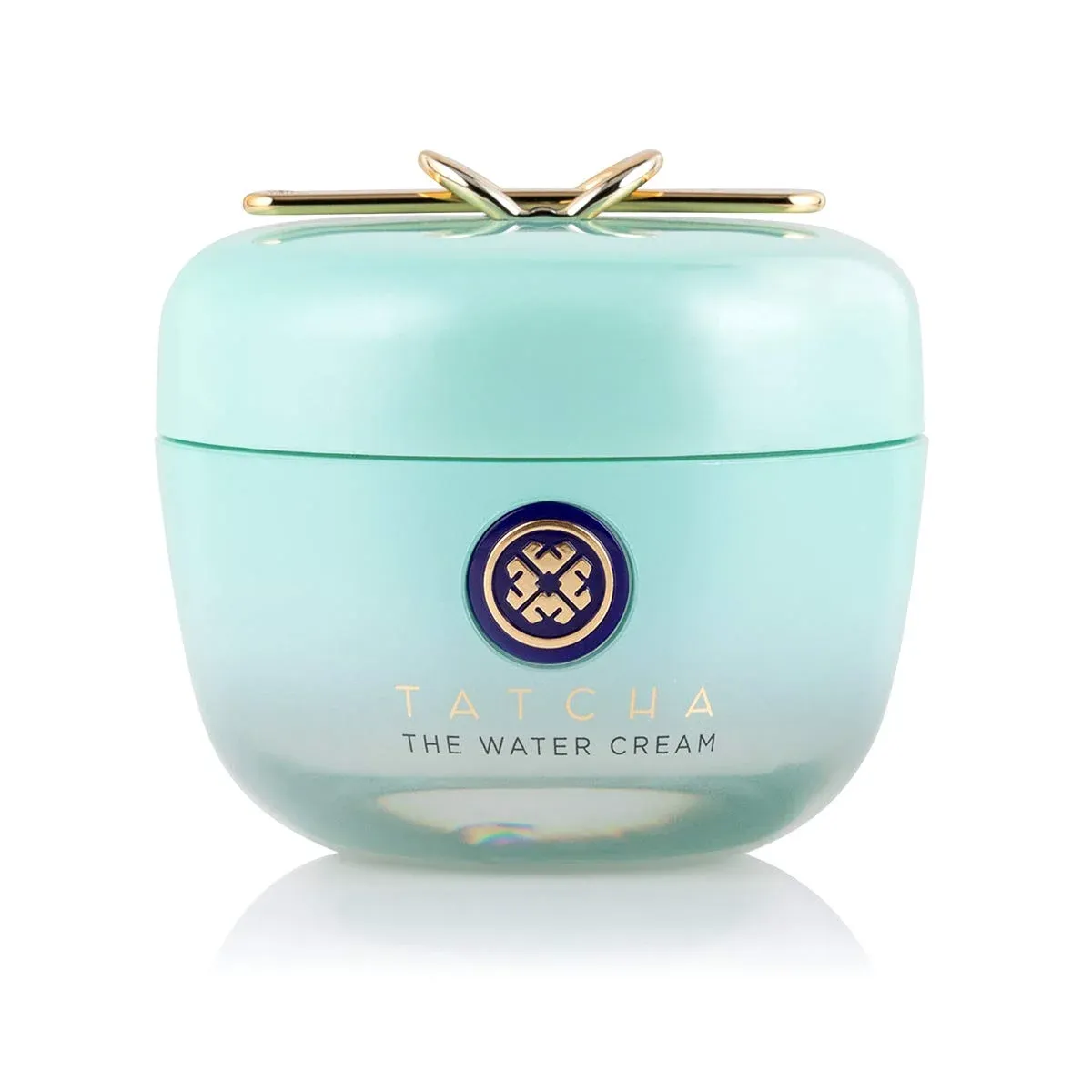 A blue jar of Tatcha face cream on white background