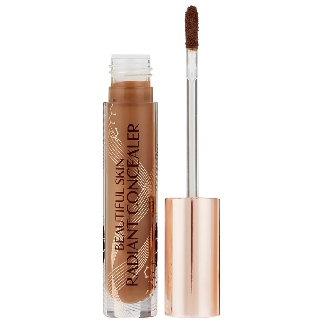 A tube of Charlotte Tilbury concealer in a medium shade against a white background