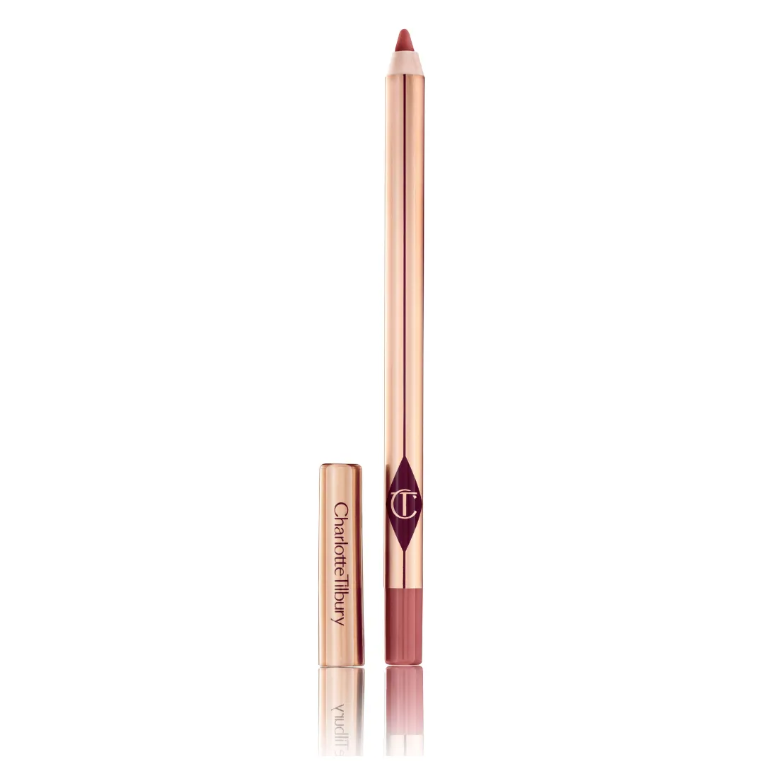 A Charlotte Tilbury lip liner in a dark pink against a light gray background