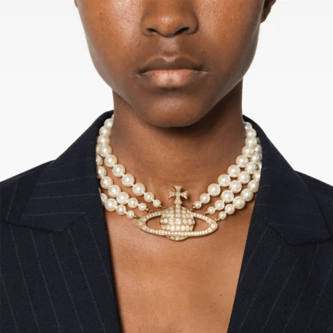 A close up of a model wearing the Vivienne Westwood Bas Relief three-row choker necklace