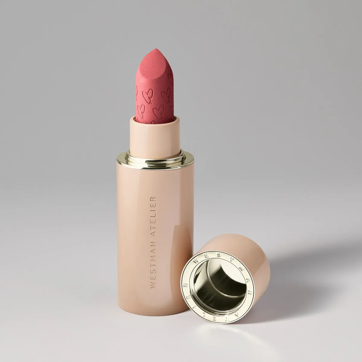 A tube of the Westman Atelier Suede Matte lipstick in Ja Reve - a medium rose color