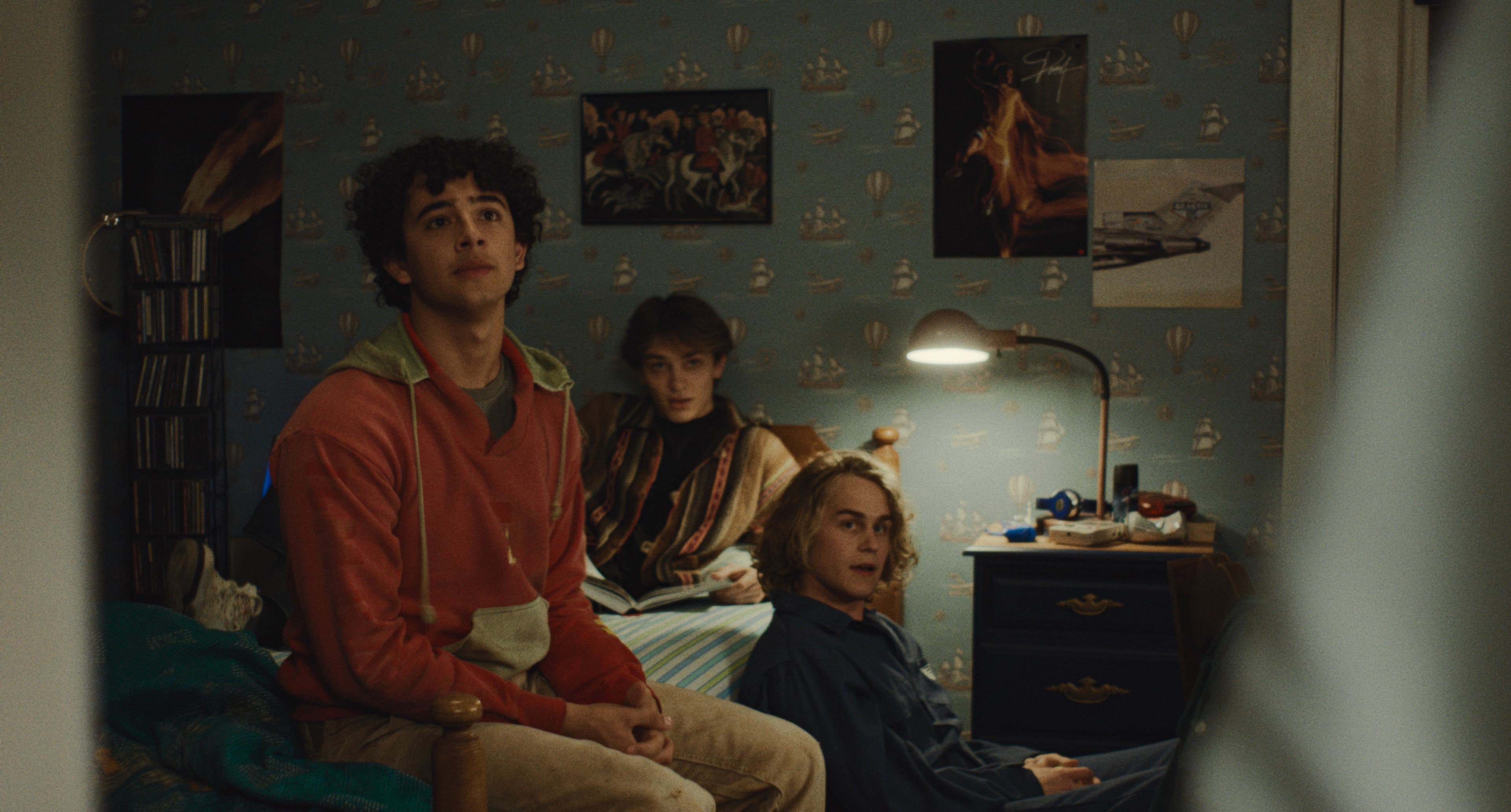 Tom's son Evan (Kingston Rumi Southwick) features a pattern of hot air balloons and boats, nodding to his desperation to leave the island.