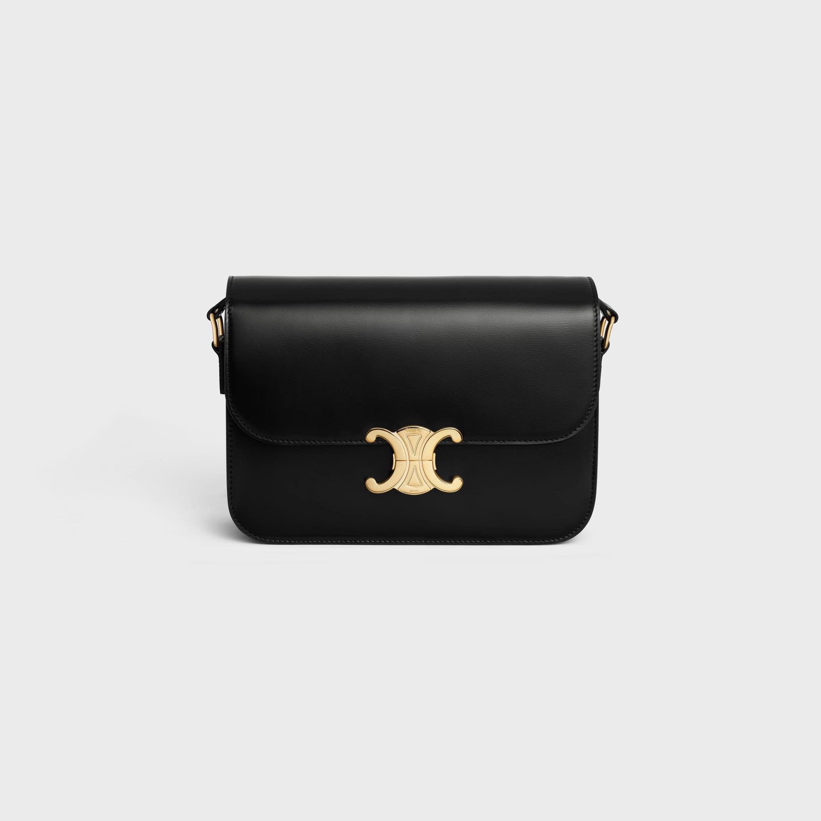 The Celinen Classique Triomphe Bag shiny calfskin against a gray background