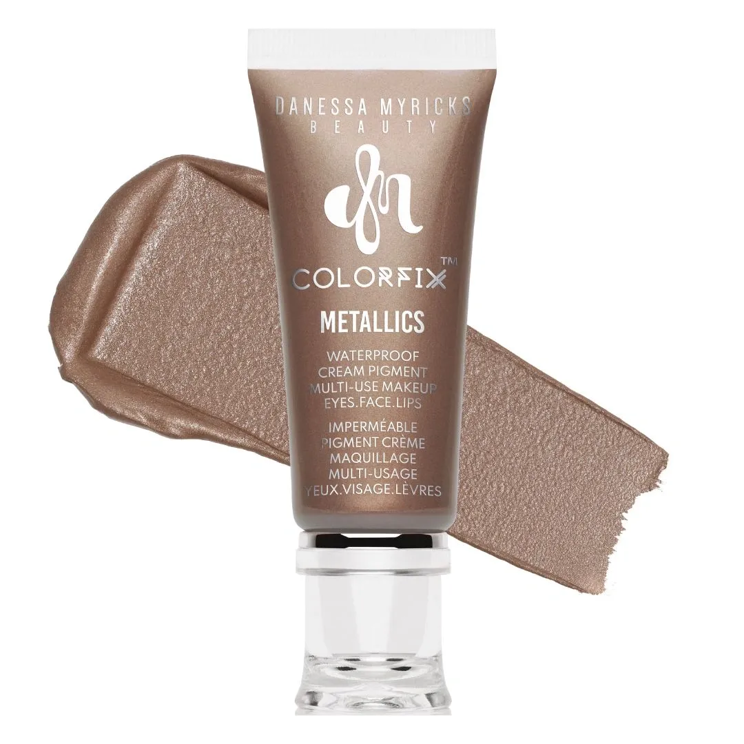 A shimmering tube of makeup pigment on white background