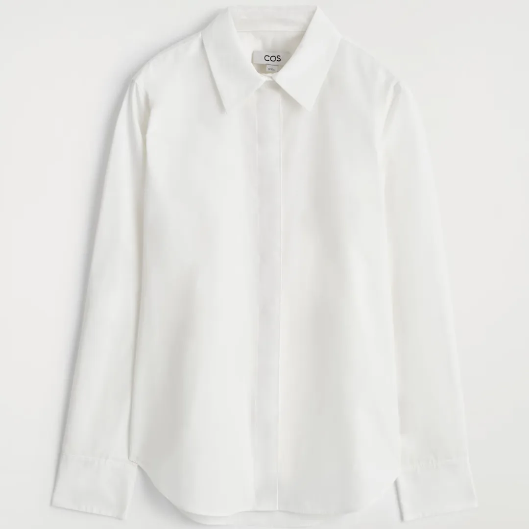 The COS Tailored Cotton Shirt against a pale gray background