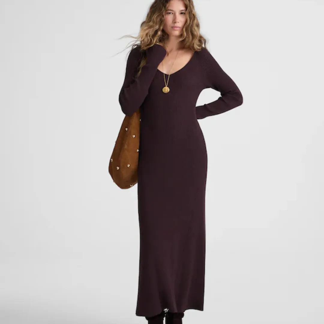A model wears the Madewell The Signature Knit V-Neck Midi Dress in an espresso shade