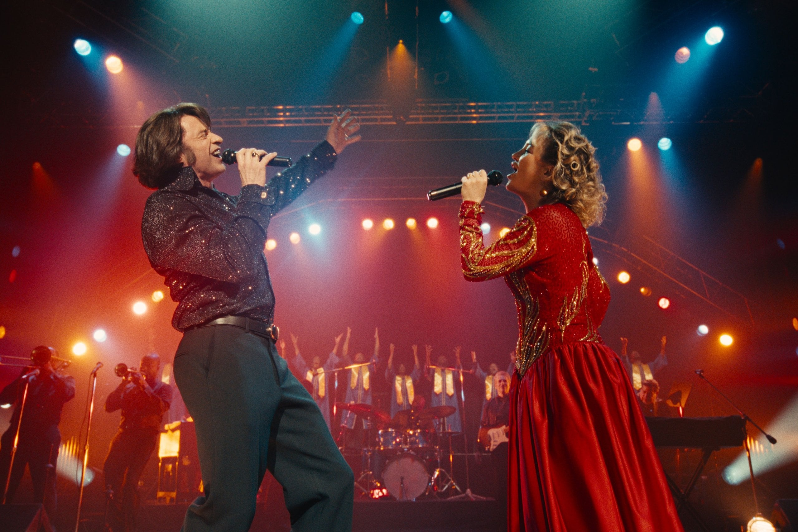 Actors Hugh Jackman and Kate Hudson peforming on-stage as the Neil Diamond tribute band, Thunder and Lightning, in the film SOng Sung Blue.